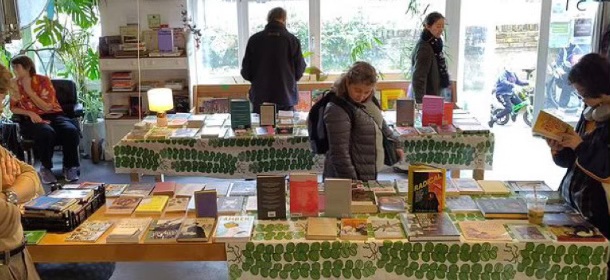 people browsing books in a popup bookshop in Pipoca